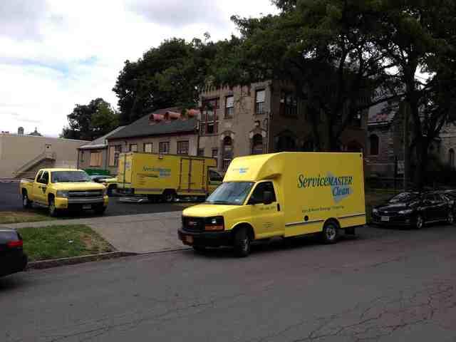 Blue and yellow ServiceMaster truck