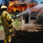 Firefighter putting out a fire 
