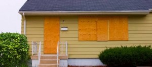 A home with boarded up windows and a door after a fire in Columbus, Ohio