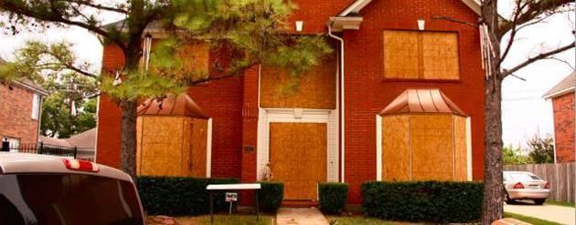 Boarded up house.
