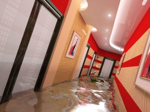 Commercial building with flooded hallways needing water damage restoration services