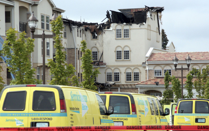 ServiceMaster vans outside of a fire-damaged apartment building in Sioux Falls