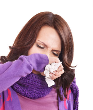 woman sneezing