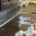 water on floor with towels